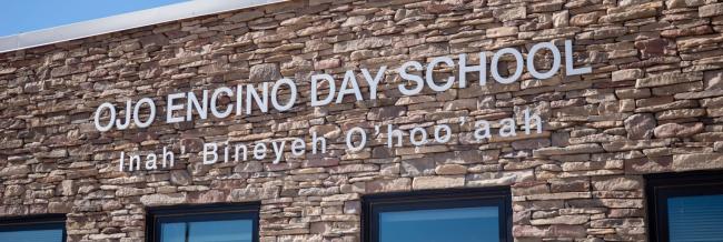 school lettering on building Ojo Encino Day School Iina' Biniye'O'hoo'aah